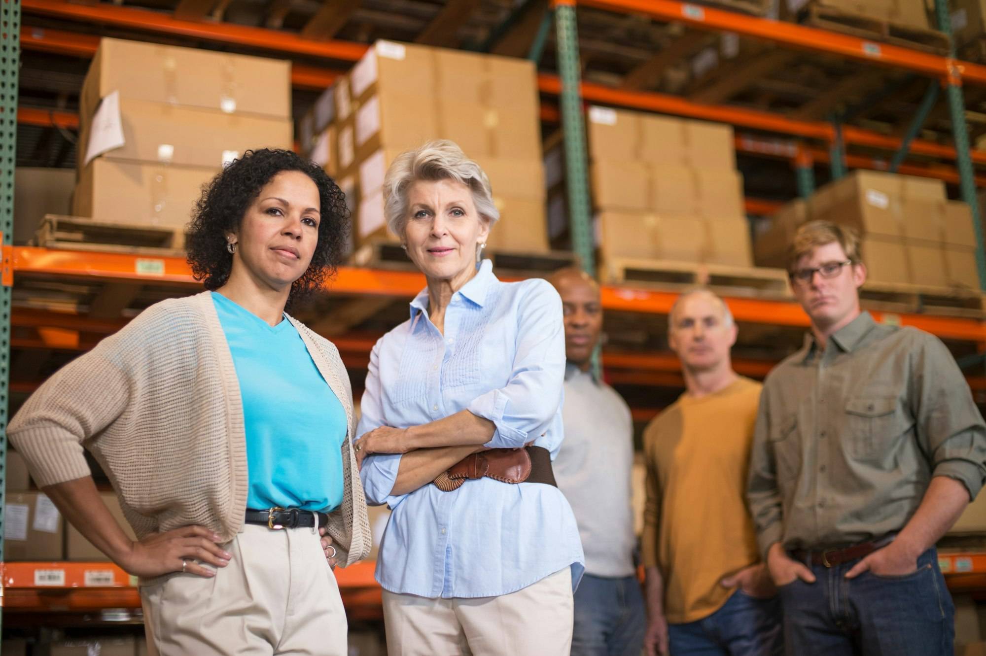 Reverse Logistics Services 6 Portrait of warehouse workers in front of boxes